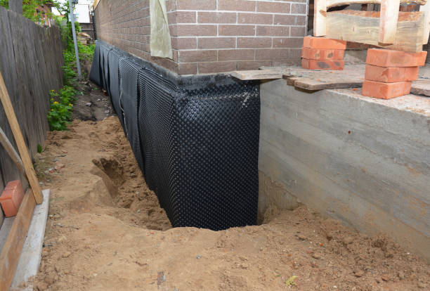 Happy homeowners after waterproofing job in Bancroft